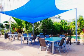 Yasi Bar + Grill features a poolside dining area with children’s playground - Cardwell @ the Beach Cardwell QLD
